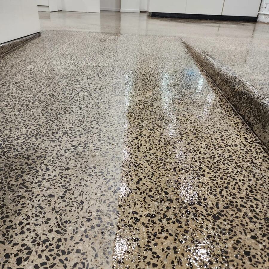 Polished concrete floor with exposed aggregate in a commercial space