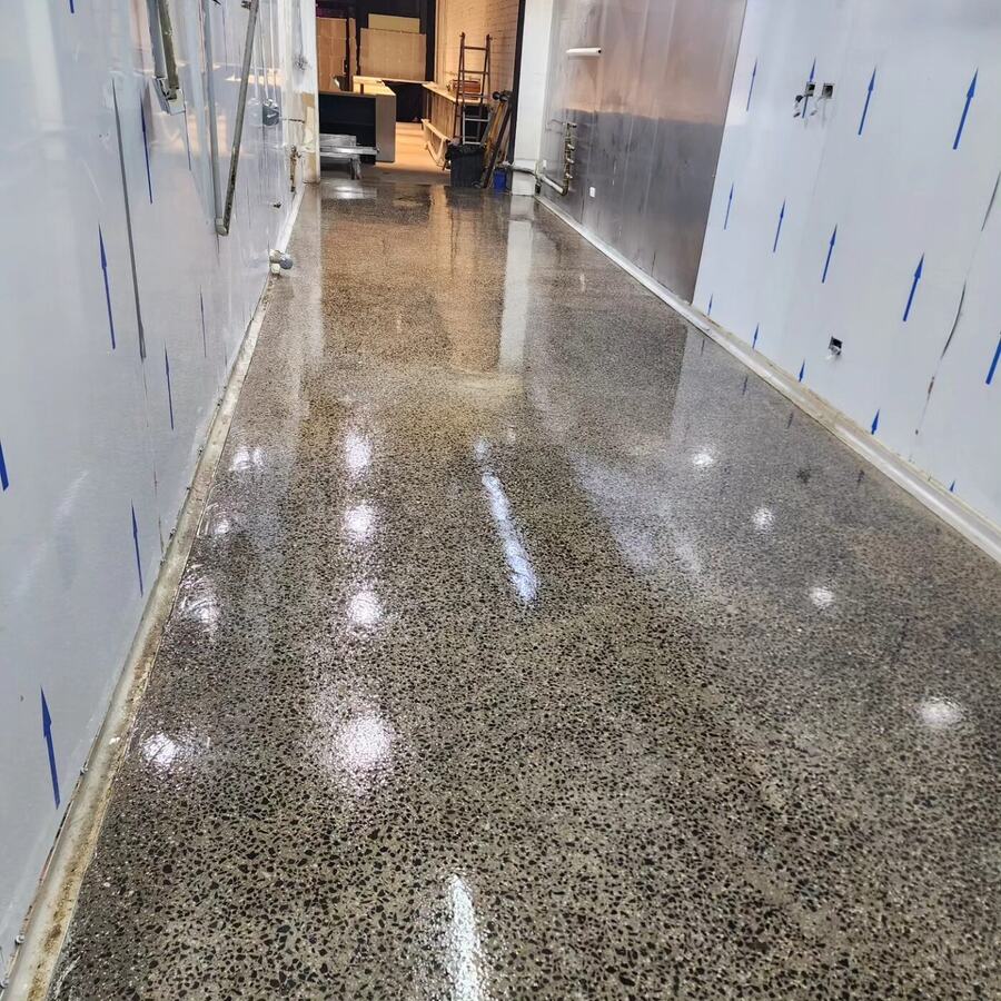 Finished commercial corridor floor with a glossy sealed finish