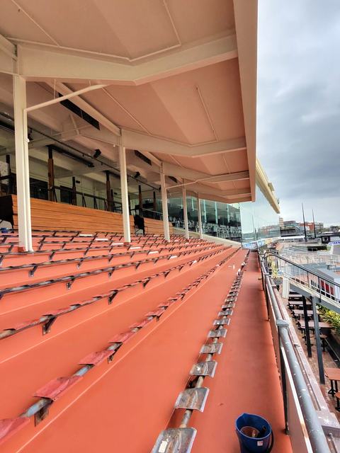 Grandstand Seating Terraces Coated in Terracotta Red — photo 6